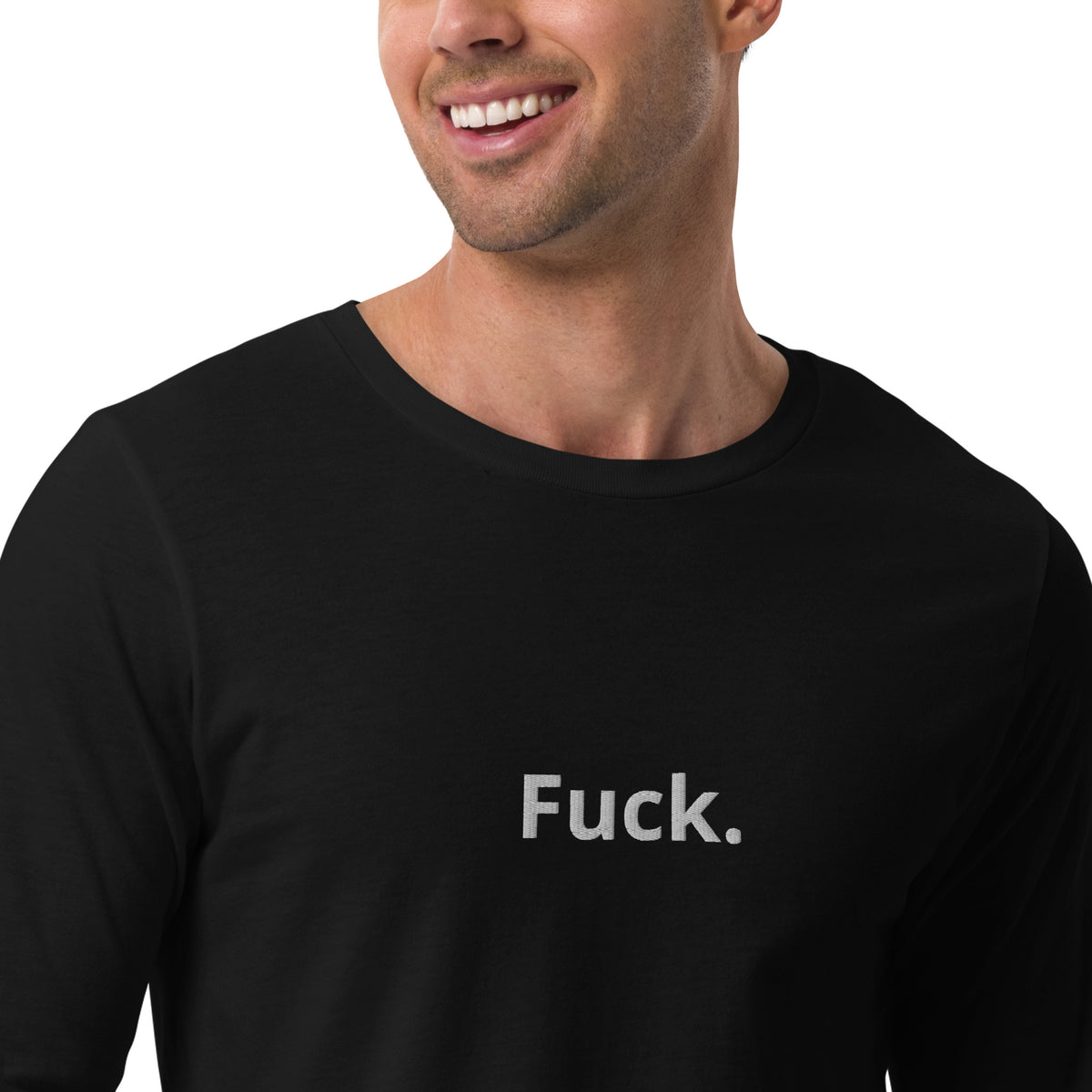 Close-up of white “Fuck.” chest lettering on a black TMiTH long sleeve tee. The Man in The Hat 907 artist merch expressing abuse-survivor solidarity.