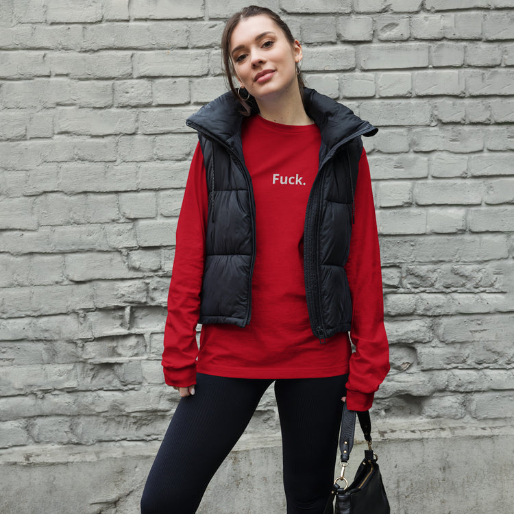 Model wearing a red Fuck. long sleeve tee under an open black vest against a brick wall. The Man in The Hat 907 artist merch expressing mental health and raw expression.